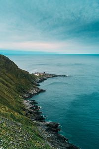 Preview wallpaper slope, rocks, sea, buildings, horizon