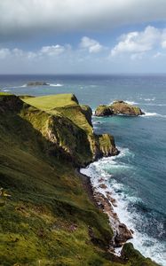 Preview wallpaper slope, rocks, sea, surf, horizon