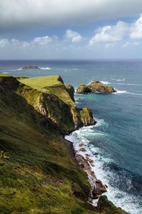 Preview wallpaper slope, rocks, sea, surf, horizon