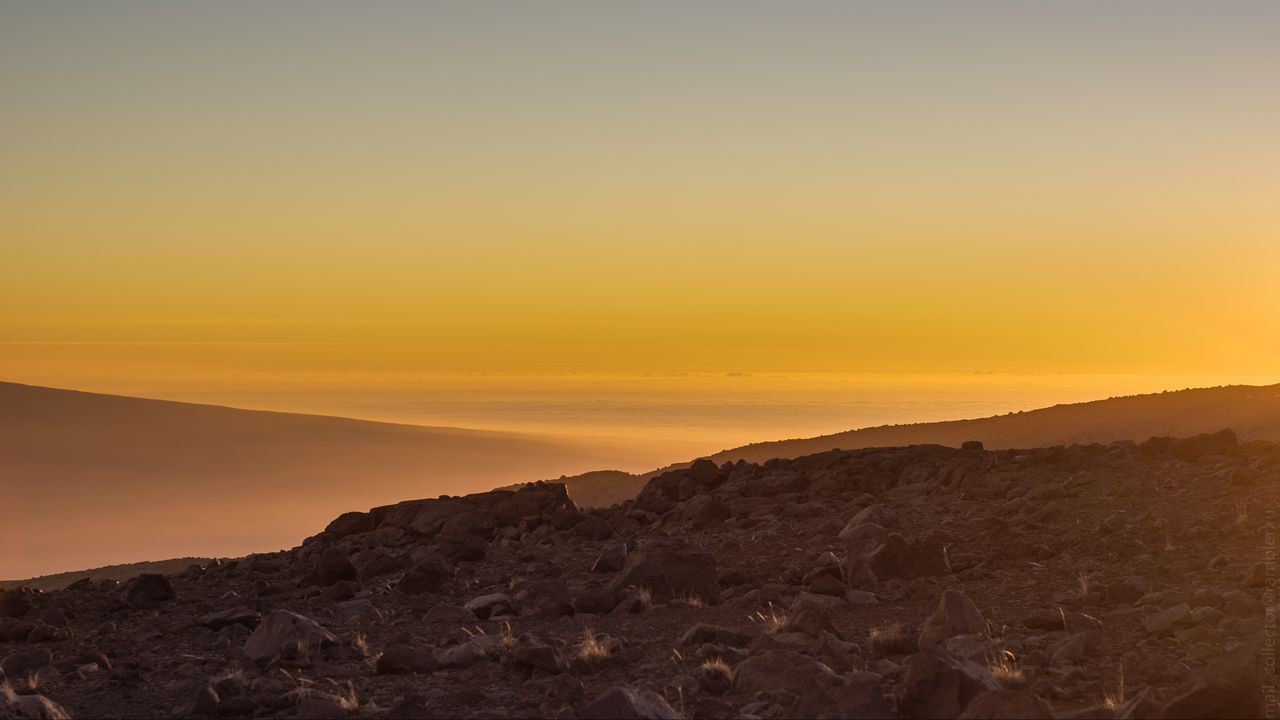 Wallpaper slope, sunset, stones, hills, sky