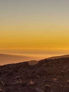 Preview wallpaper slope, sunset, stones, hills, sky