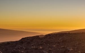 Preview wallpaper slope, sunset, stones, hills, sky