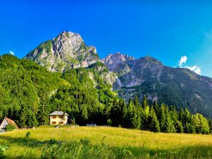 Preview wallpaper slovenia, mountains, lodges, meadow, green, brightly, sky, blue, clearly