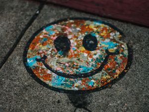 Preview wallpaper smile, colorful, asphalt, paint, graffiti