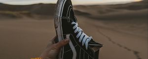Preview wallpaper sneaker, sand, hand, shoes, desert