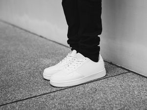 Preview wallpaper sneakers, legs, bw, minimalism