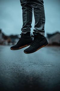 Preview wallpaper sneakers, legs, jeans, asphalt