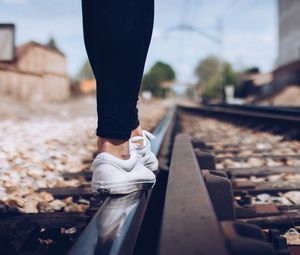 Preview wallpaper sneakers, legs, railway