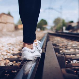 Preview wallpaper sneakers, legs, railway