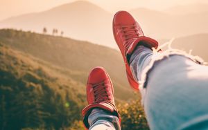 Preview wallpaper sneakers, legs, red, mountains