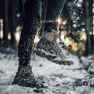 Preview wallpaper sneakers, legs, snow, snowflakes