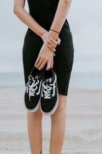 Preview wallpaper sneakers, shoes, black, girl, beach
