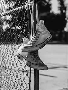 Preview wallpaper sneakers, shoes, bw, mesh, fence