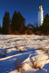 Preview wallpaper snow, beacon, trees, lake michigan