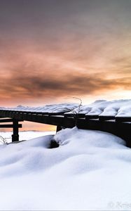 Preview wallpaper snow, building, winter, clouds