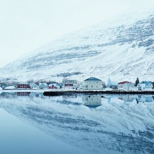 Preview wallpaper snow, hills, river, buildings