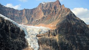 Preview wallpaper snow, mountains, avalanche, gorge