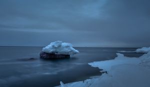 Preview wallpaper snow, sea, stone, ice, sky, cloudy