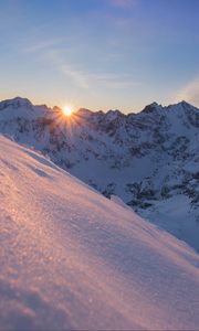 Preview wallpaper snow, sun, rays, rocks, slope