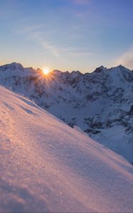 Preview wallpaper snow, sun, rays, rocks, slope