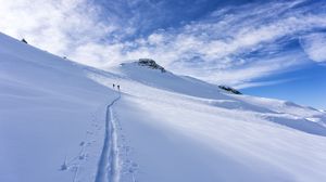 Preview wallpaper snow, trace, skiers, silhouettes, slope, mountain