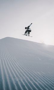 Preview wallpaper snowboarder, snowboard, helmet, snow, jump