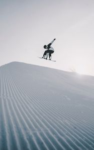 Preview wallpaper snowboarder, snowboard, helmet, snow, jump