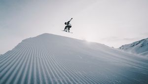 Preview wallpaper snowboarder, snowboard, helmet, snow, jump