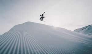 Preview wallpaper snowboarder, snowboard, helmet, snow, jump