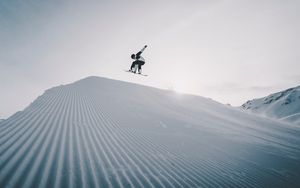 Preview wallpaper snowboarder, snowboard, helmet, snow, jump
