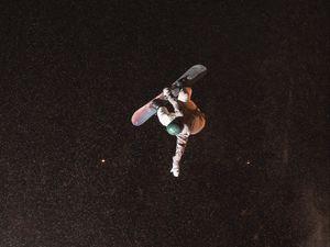 Preview wallpaper snowboarder, snowboard, helmet, slope, jump