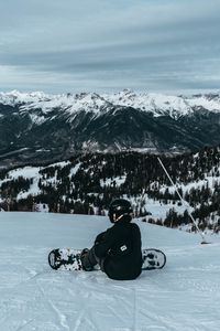 Preview wallpaper snowboarder, snowboard, snow, mountains, winter