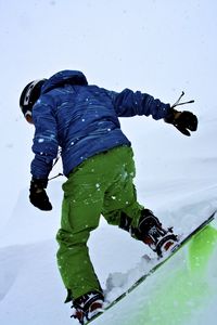 Preview wallpaper snowboarder, snowboard, snowfall, winter