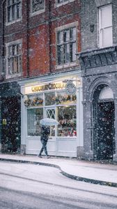 Preview wallpaper snowfall, man, buildings, street, walk