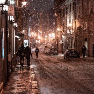Preview wallpaper snowfall, people, street, night, evening, city, winter