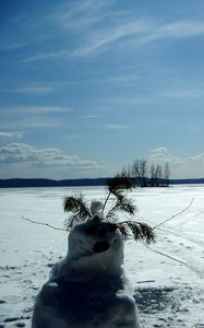 Preview wallpaper snowman, field, traces, trees