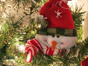 Preview wallpaper snowman, smiling, tree, pine needles, holiday, new year, christmas