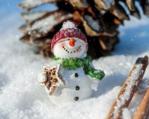 Preview wallpaper snowman, snow, cinnamon, pine cone, christmas, new year