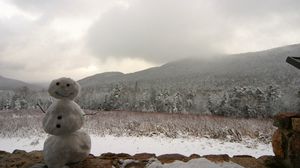 Preview wallpaper snowman, winter, mountains, trees, fog, clouds