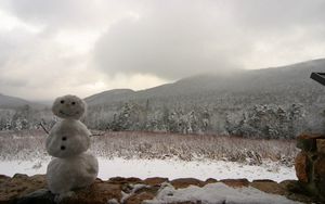 Preview wallpaper snowman, winter, mountains, trees, fog, clouds