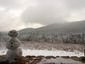 Preview wallpaper snowman, winter, mountains, trees, fog, clouds