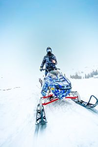 Preview wallpaper snowmobile, man, helmet, snow, winter