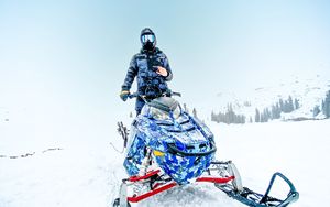 Preview wallpaper snowmobile, man, helmet, snow, winter