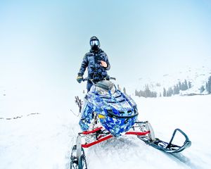 Preview wallpaper snowmobile, man, helmet, snow, winter