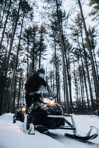 Preview wallpaper snowmobile, snow, winter, man, forest, nature