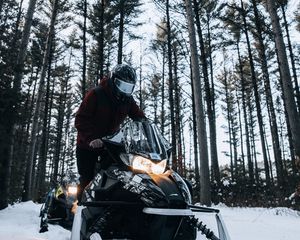 Preview wallpaper snowmobile, snow, winter, man, forest, nature