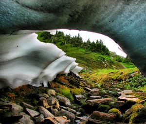 Preview wallpaper snowpack, river, stream, rocks, hills, nature