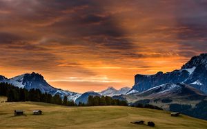 Preview wallpaper snowy mountains, sunset, grass, sky