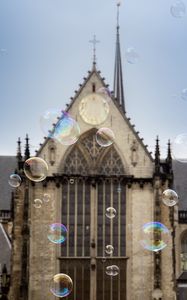 Preview wallpaper soap bubbles, building, towers, blur