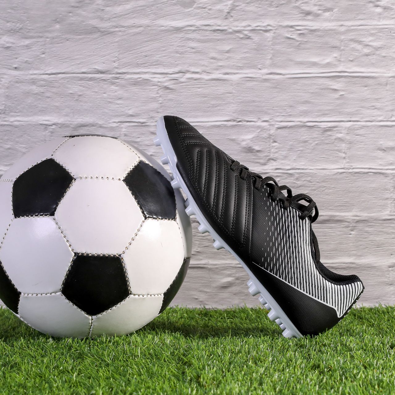 Download wallpaper 1280x1280 soccer ball, boot, grass, football, sport  ipad, ipad 2, ipad mini for parallax hd background